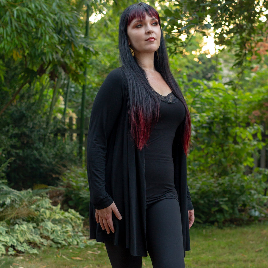 Model wearing long rayon black cardigan