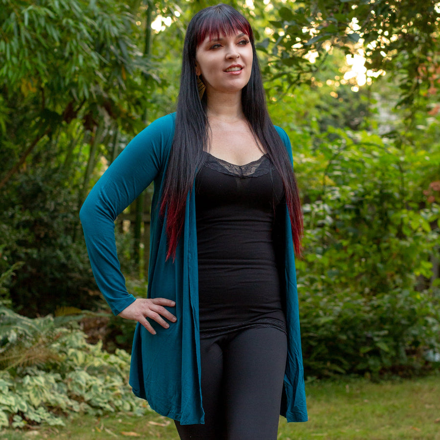 Model wearing long rayon cardigan teal color